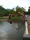 Young boys and girls leap off a bridge somewhere in Northern Laos - Karina Noriega